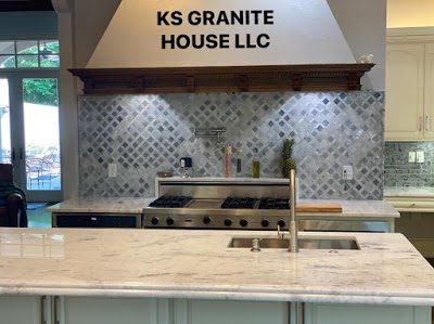 Chef's kitchen with marble-look tops by KS Granite House