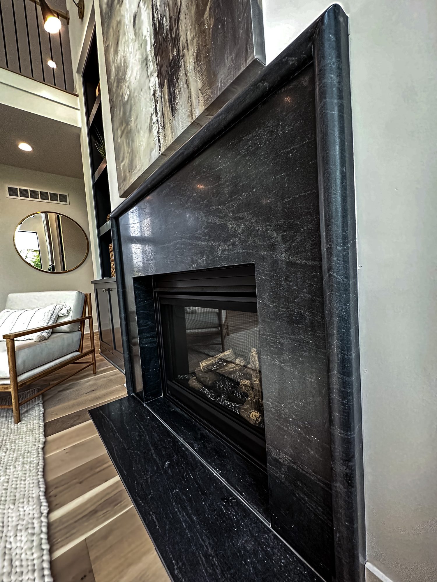 Floor-to-ceiling fireplace surround by KS Granite House